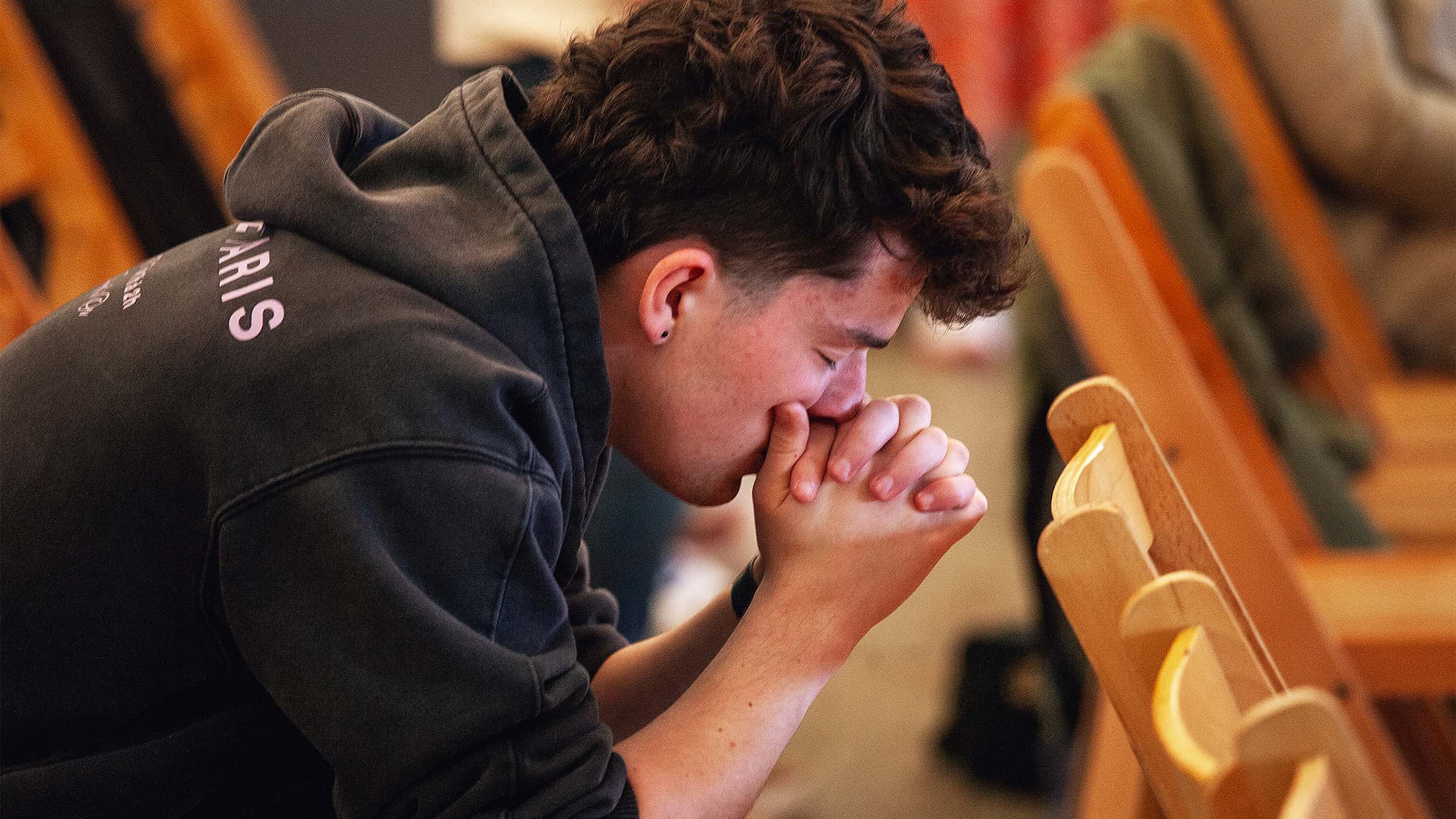 Man leading forward in prayer