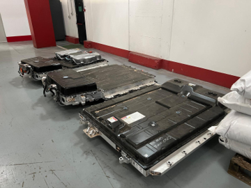 End-of-life automotive lithium HV battery packs ready for recycling treatment