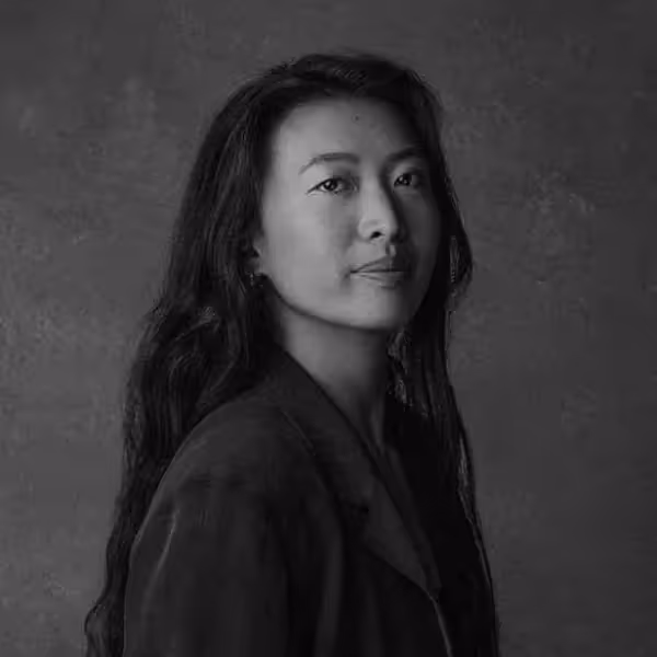 kat zhou headshot - woman with long dark hair in black and white