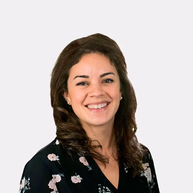 megan campos headshot - woman with long dark hair against a white background