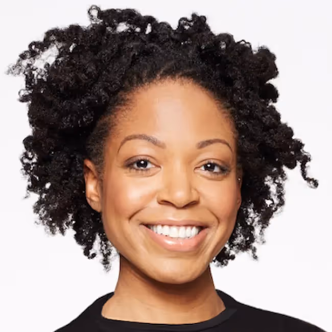 Christelle Ngnoumen, PhD headshot - woman with curly hair smiling against white background