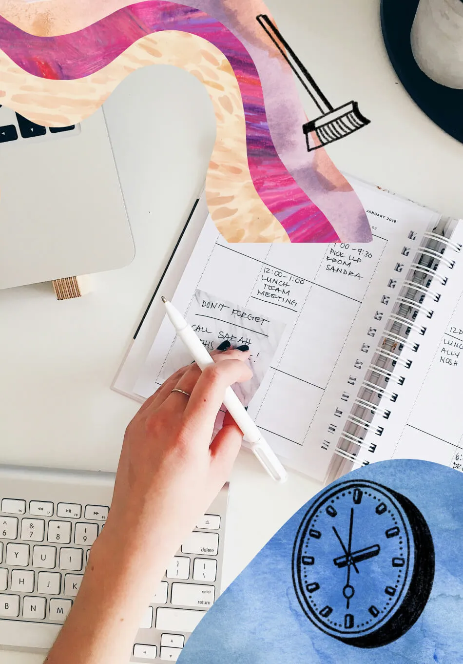 photo of hand placing sticky note onto a planner with keyboard and laptop in view