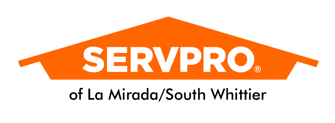 SERVPRO logo with orange house-shaped roof and text 'Fire and Water - Cleanup & Restoration'.