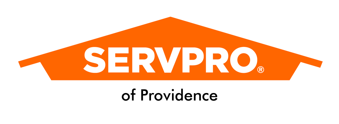 SERVPRO logo featuring the company name in bold white letters inside an orange house-shaped outline.