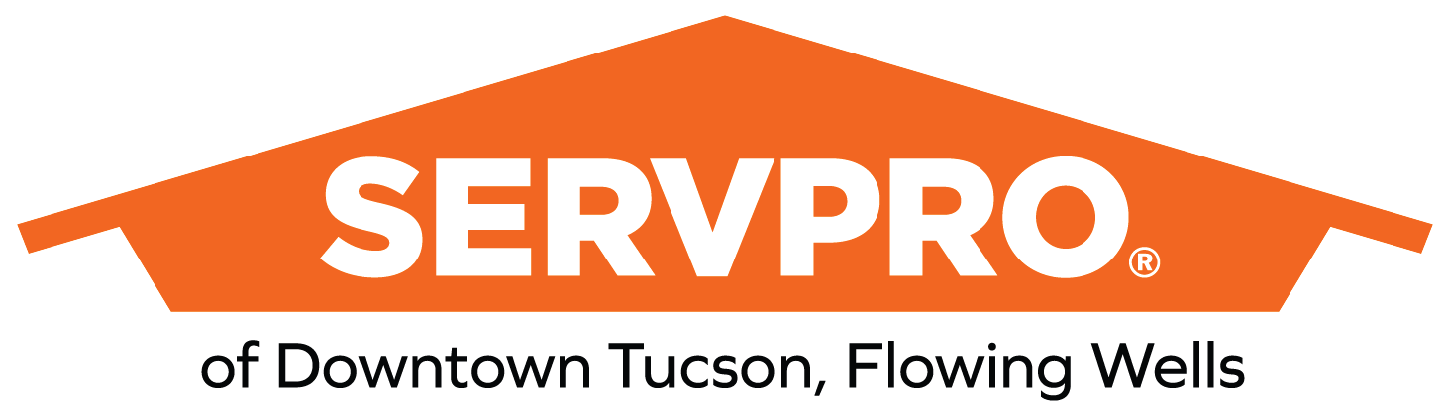 SERVPRO logo with an orange roof shape and text reading 'of Downtown Tucson, Flowing Wells' underneath.