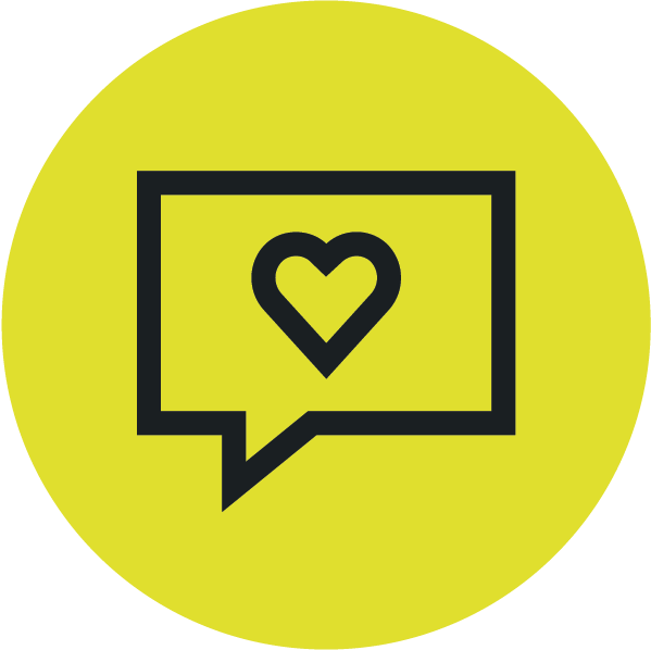 Black speech bubble with a heart symbol inside on yellow circular background.
