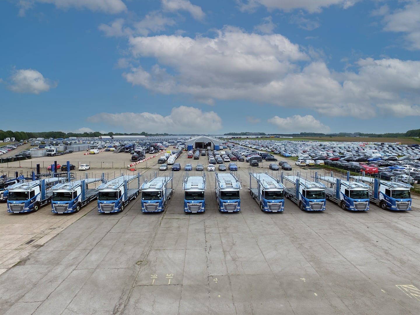 An aerial view of a lot of cars and lorries