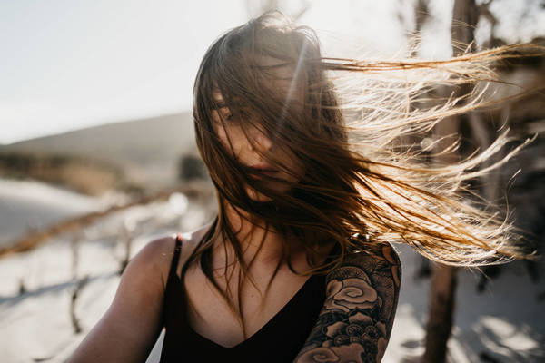 Young Woman With Long Hair At Beach