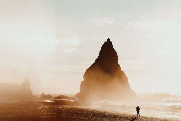 Silhouette Man Standing At Beach Against Sky