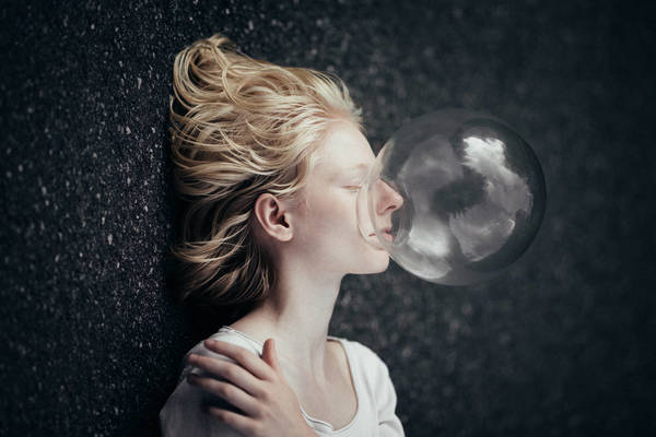 Crystal Ball On Young Woman Lying On Field