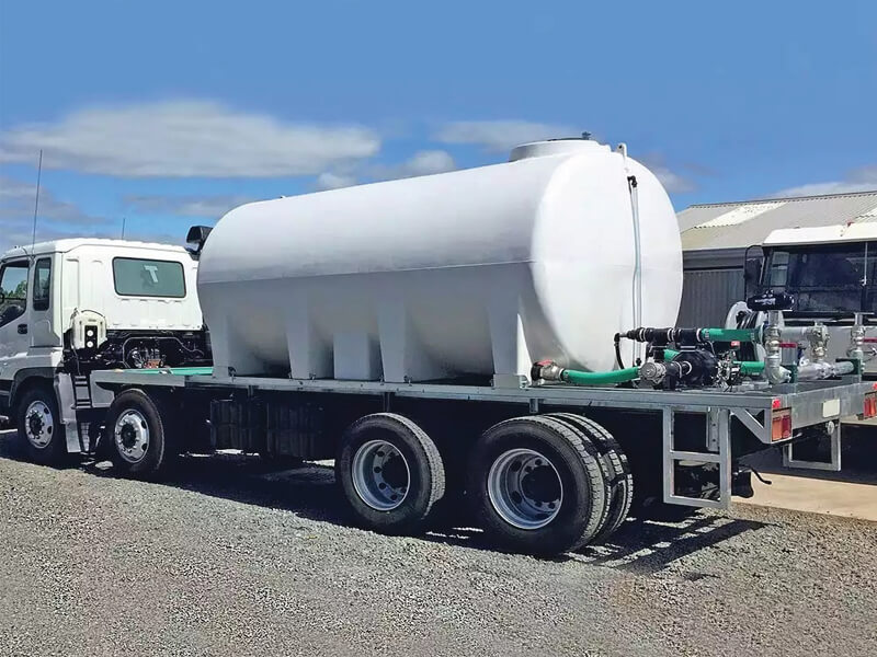 A Liquid Transport Tank being used to suppress dust on a building site
