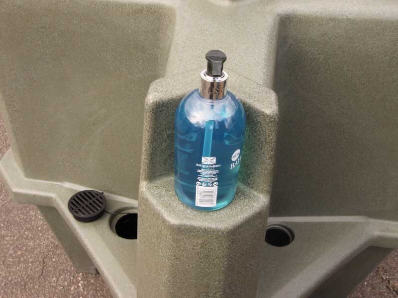 Shelf for users' drinks or liquid sanitiser dispensers