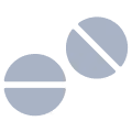 Two round pills, one with a horizontal line and the other with a diagonal line scored across it.