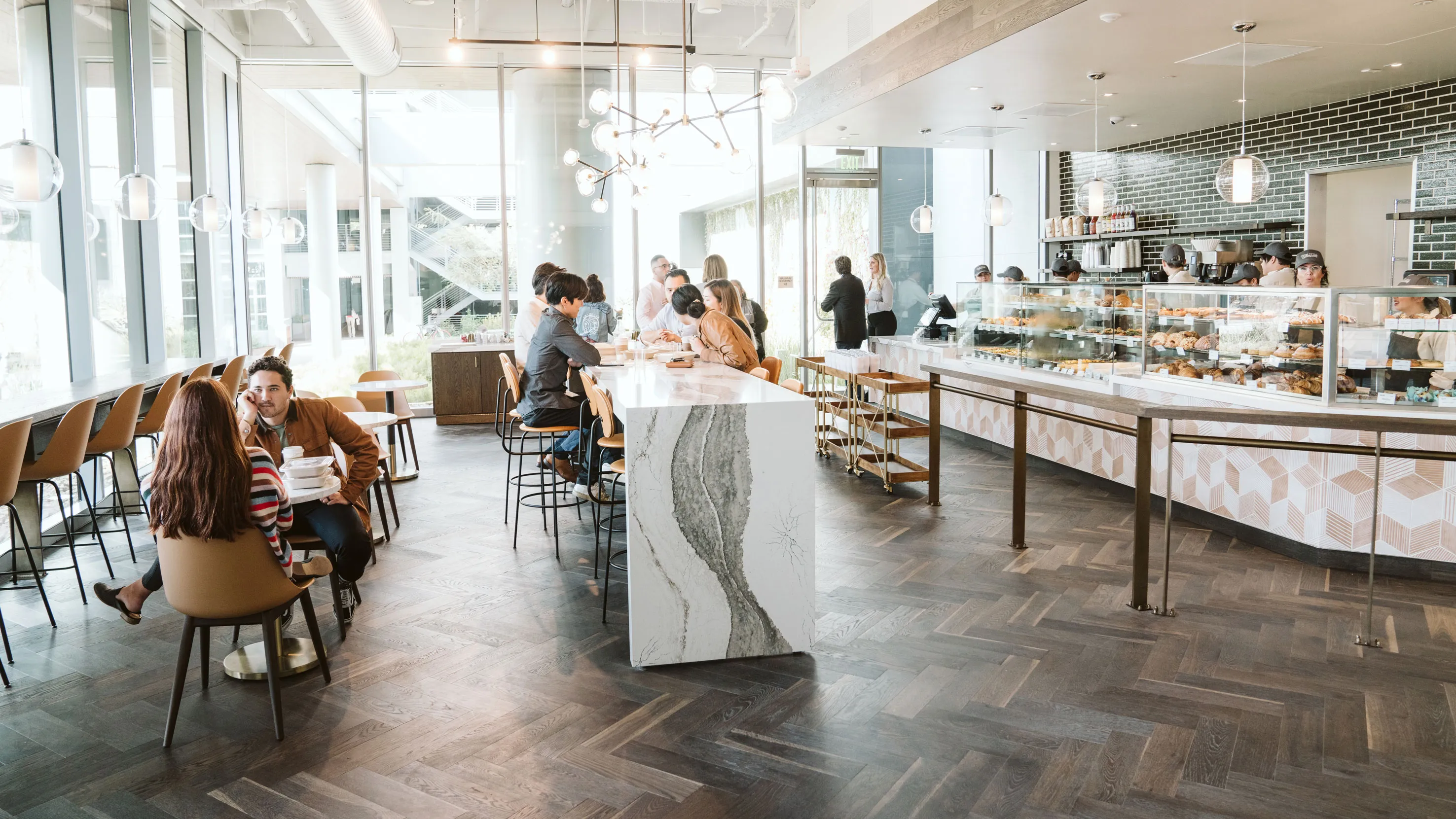 Cafe seating and bakery counter inside Ellie's Table at The Boardwalk in Irvine
