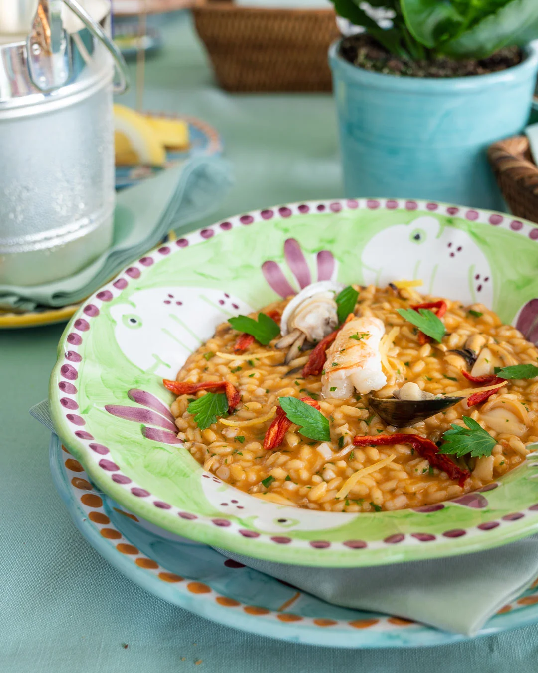 Plated seafood dish served on colorful Italian tableware