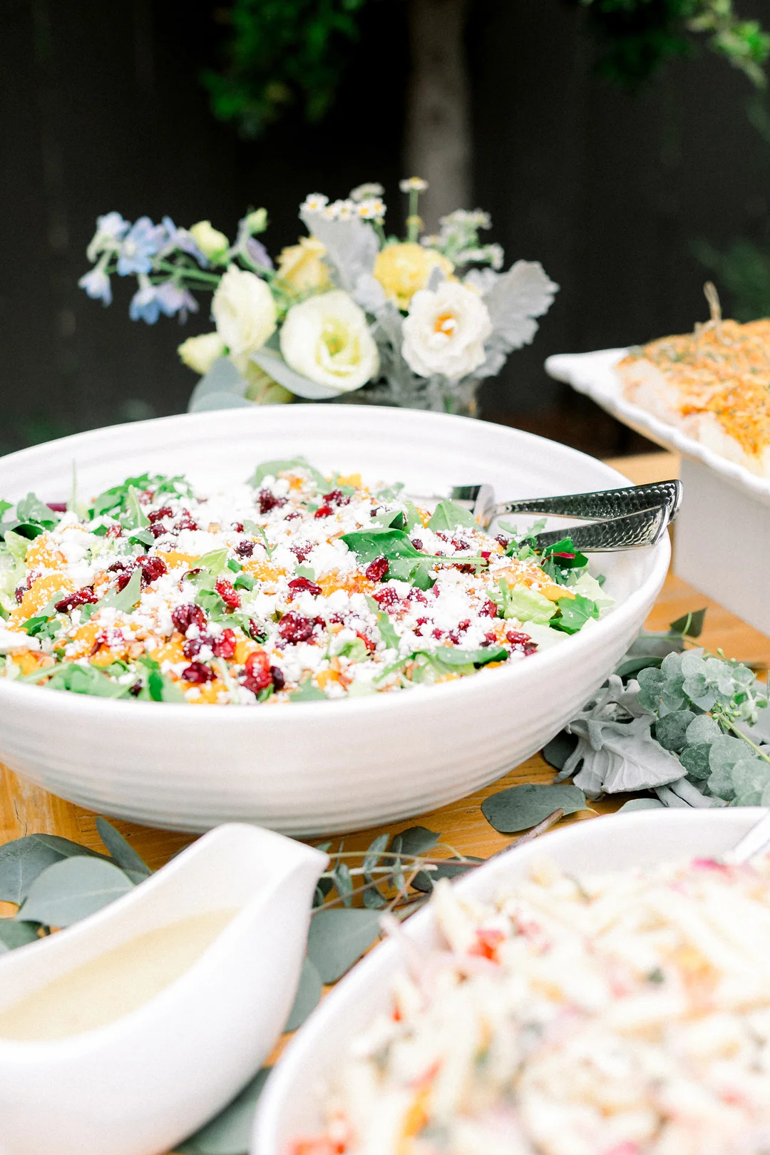 Tangerine pecan salad in a white serving bowl