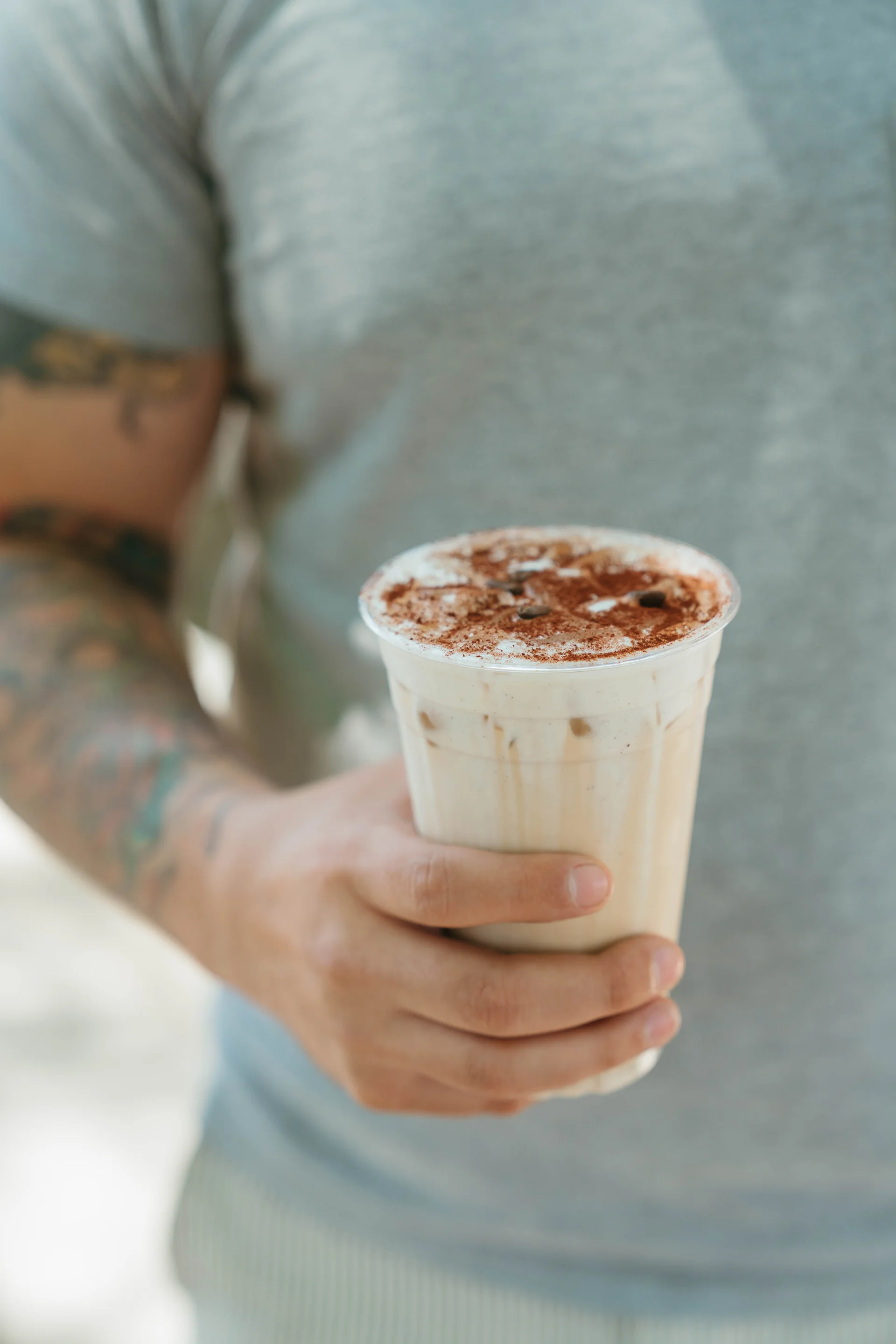 Person holding a tiramisu latte