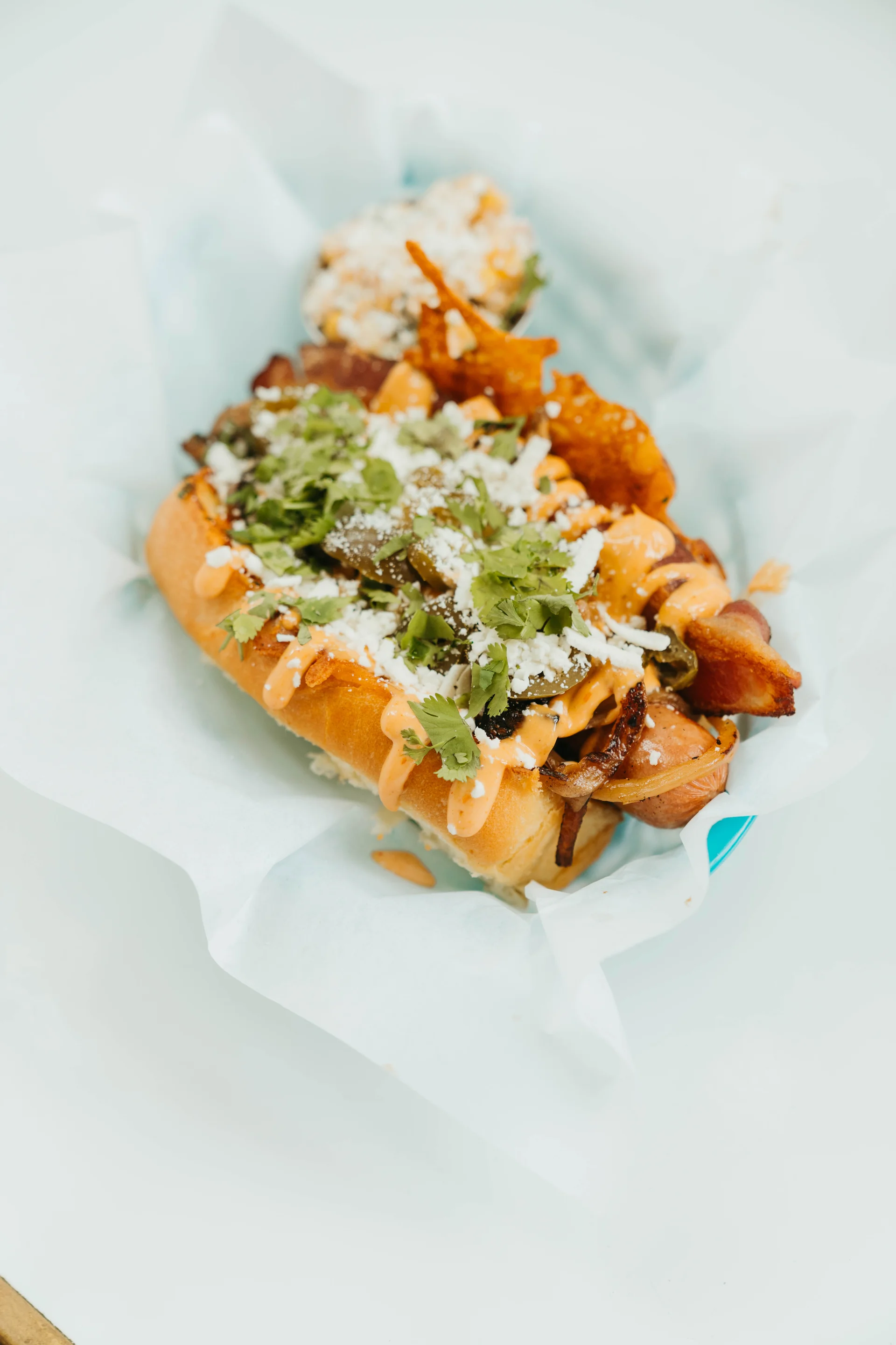 Overhead view of a Summer Dog with colorful toppings