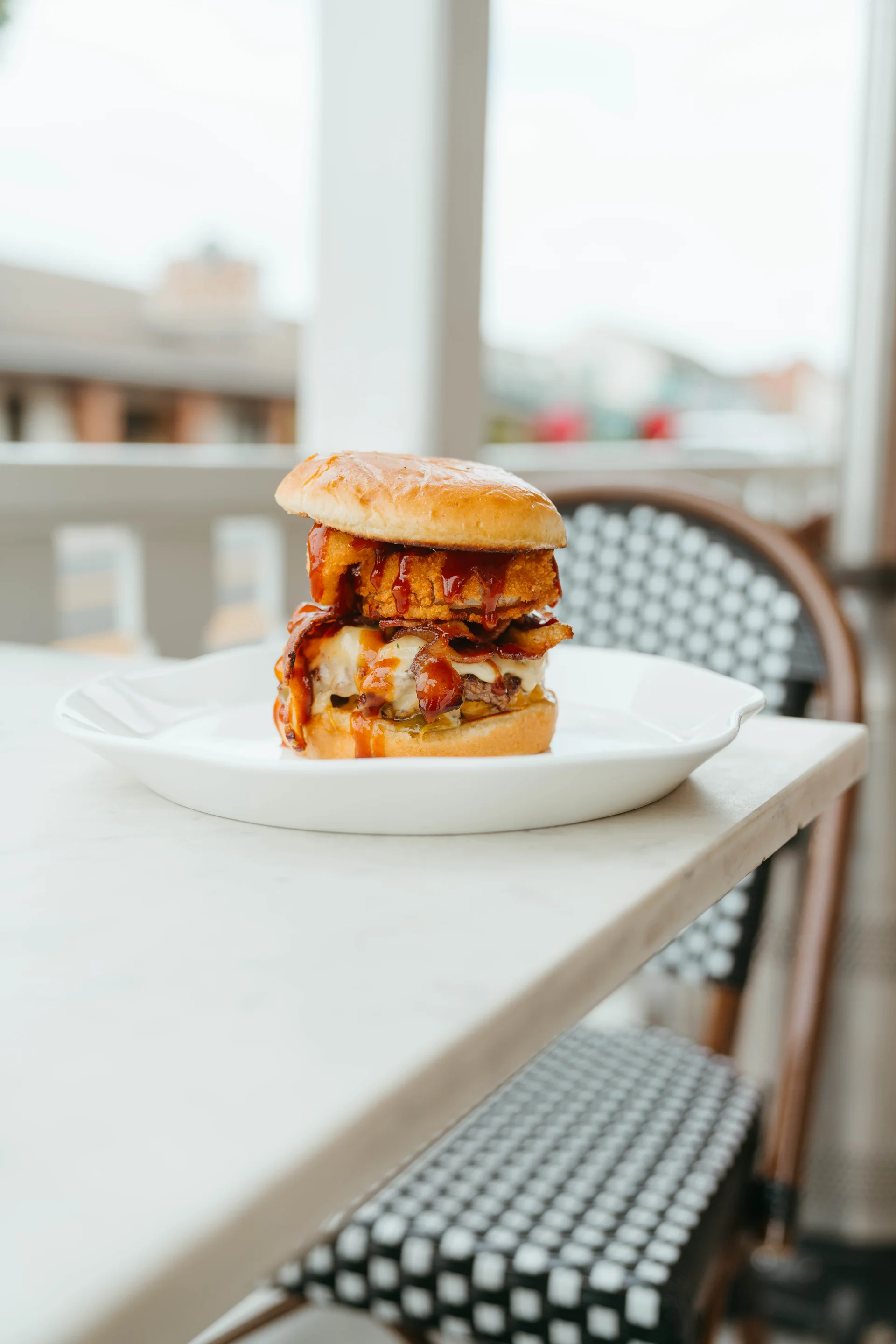 Cowboy Killer burger with bacon, jalapeño, cheese, and onion rings