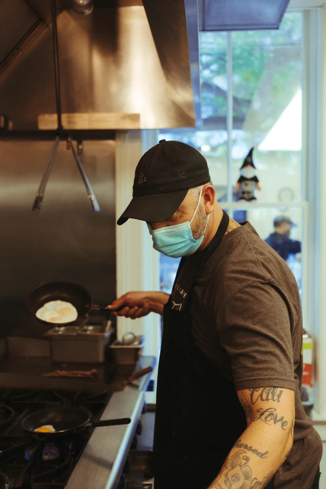 Chef Ken flipping an egg in a skillet