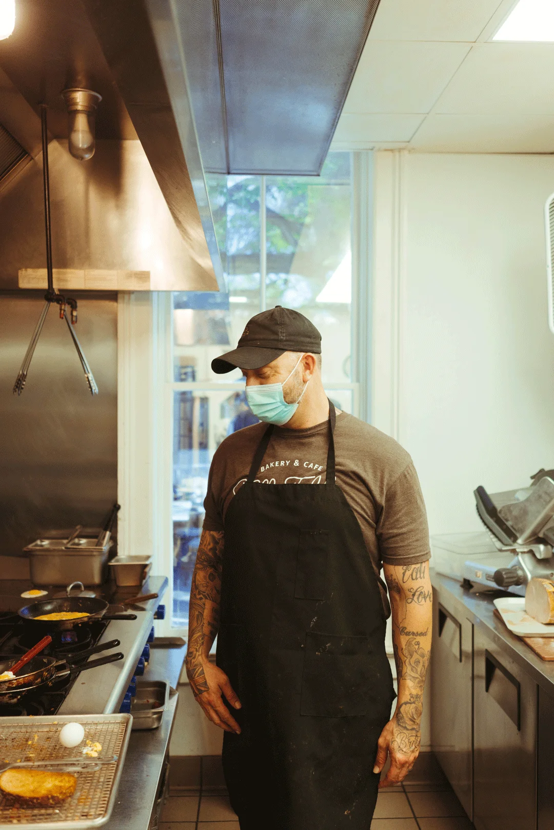 Chef Ken standing beside the kitchen range