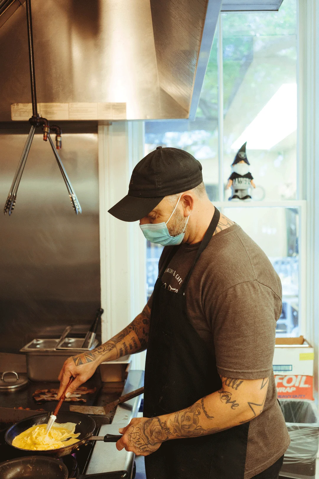 Chef Ken cooking eggs in a skillet