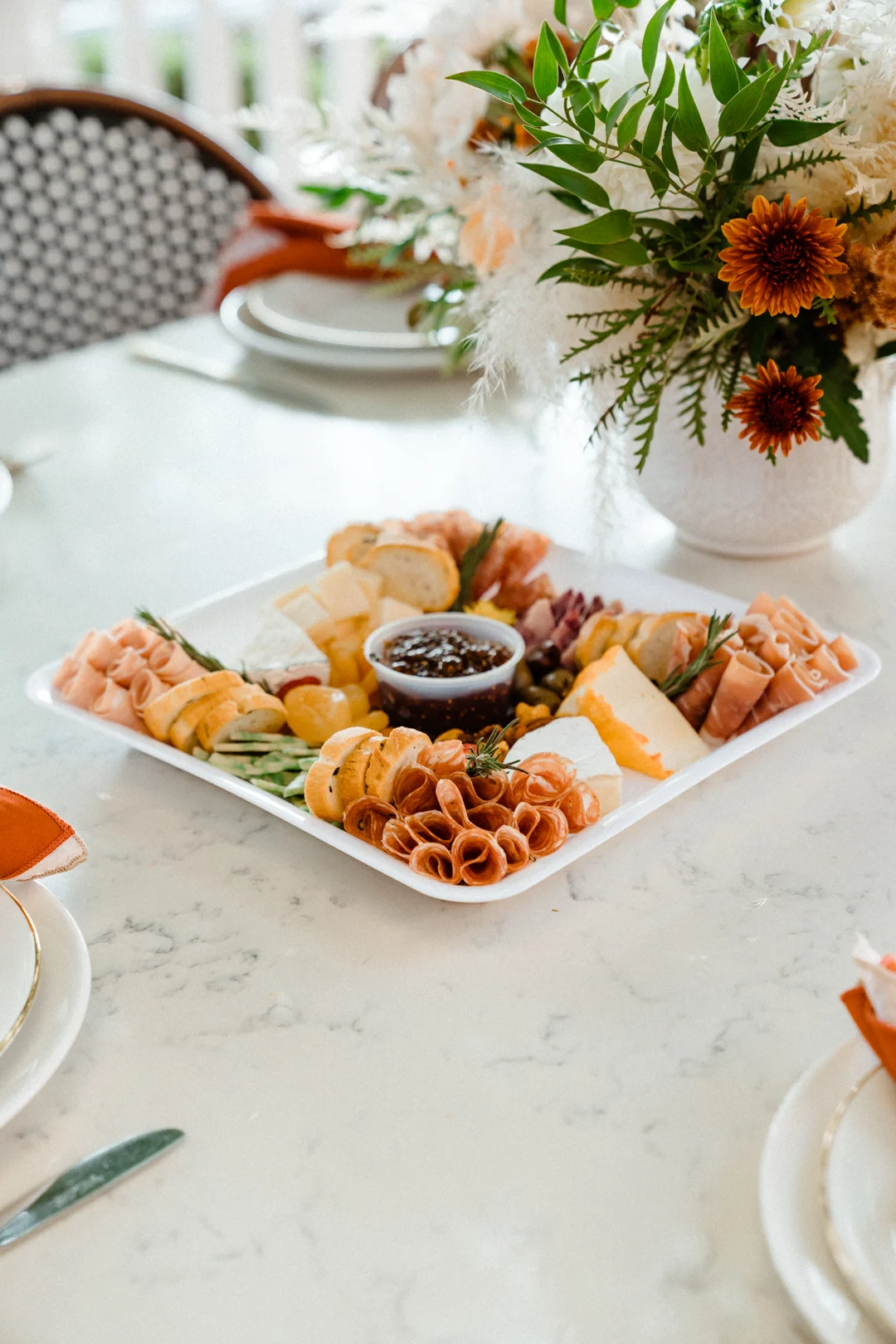 Charcuterie platter centered on the celebration table