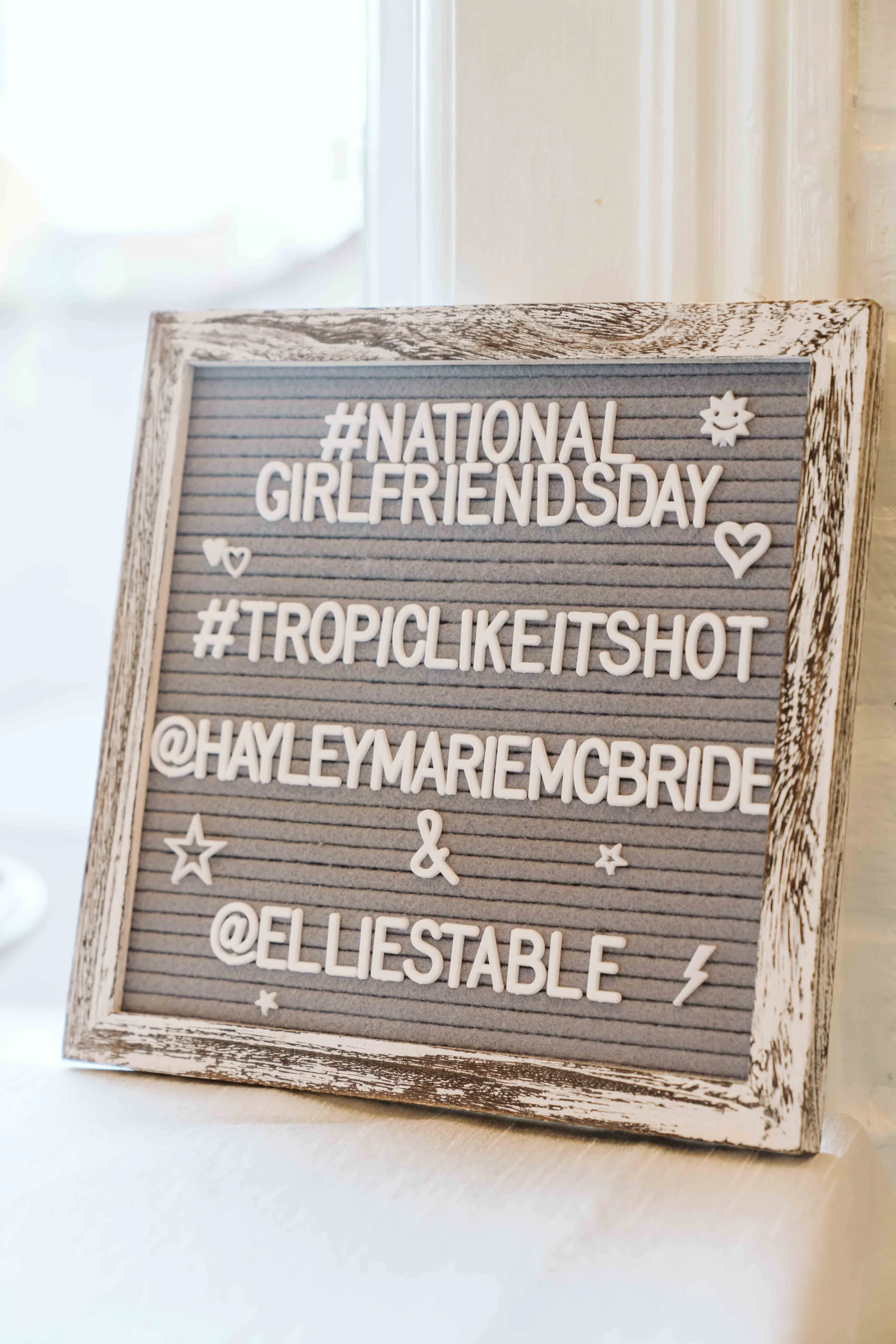 Chalkboard welcome sign for the National Girlfriends Day dinner at Ellie’s Table