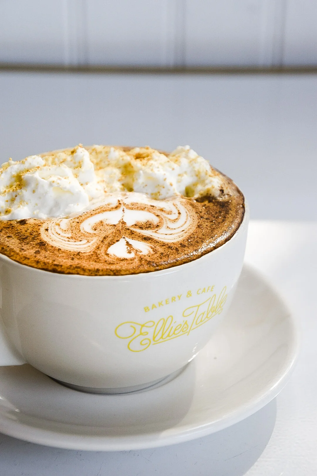 Pumpkin pie latte topped with whipped cream and graham cracker crumbs