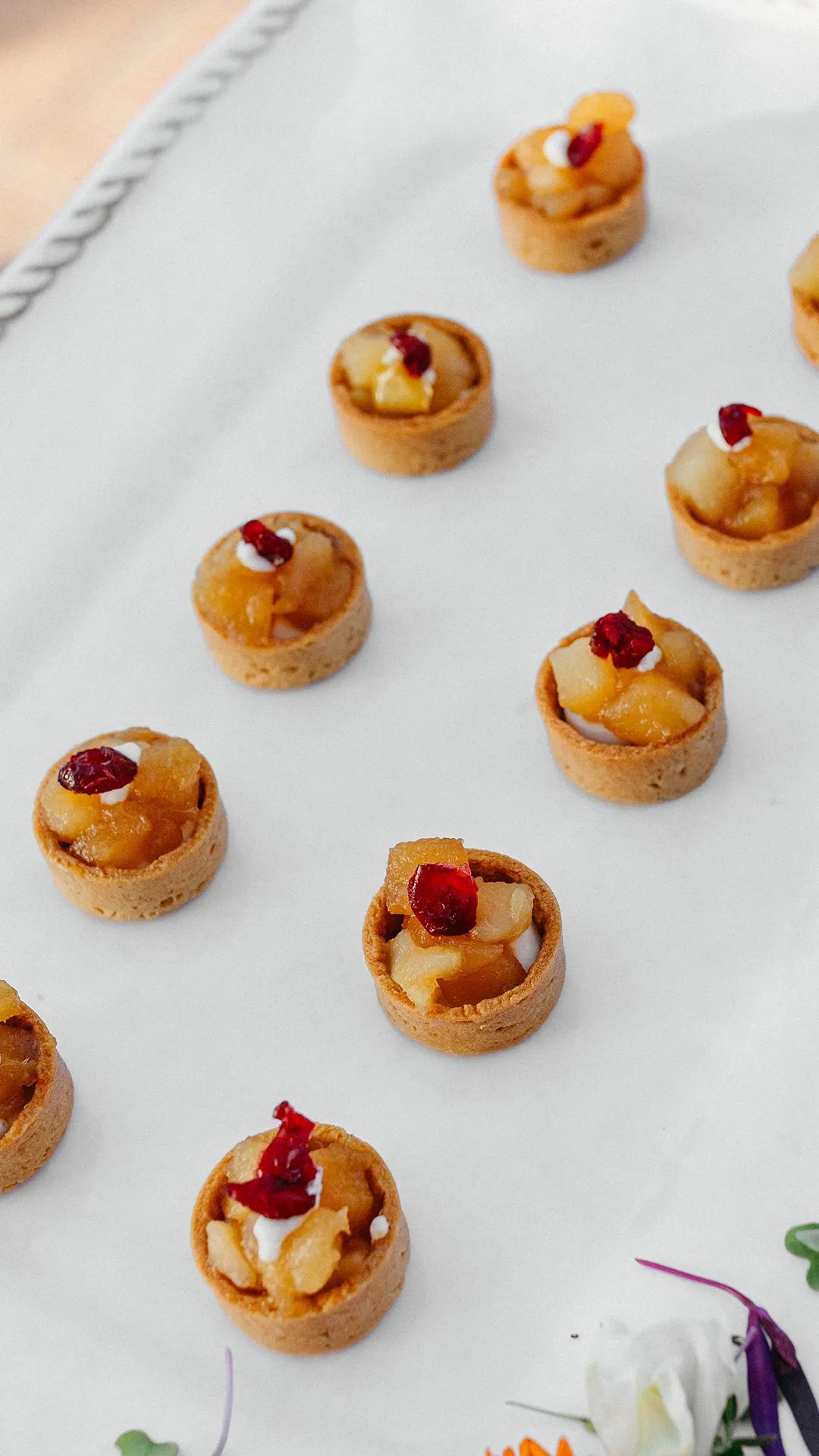 Rows of bite-size fruit tartlets