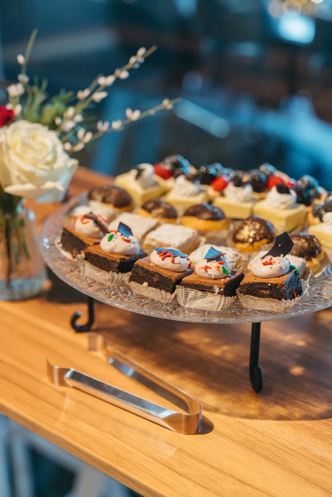 Raised tray of assorted bite-size desserts