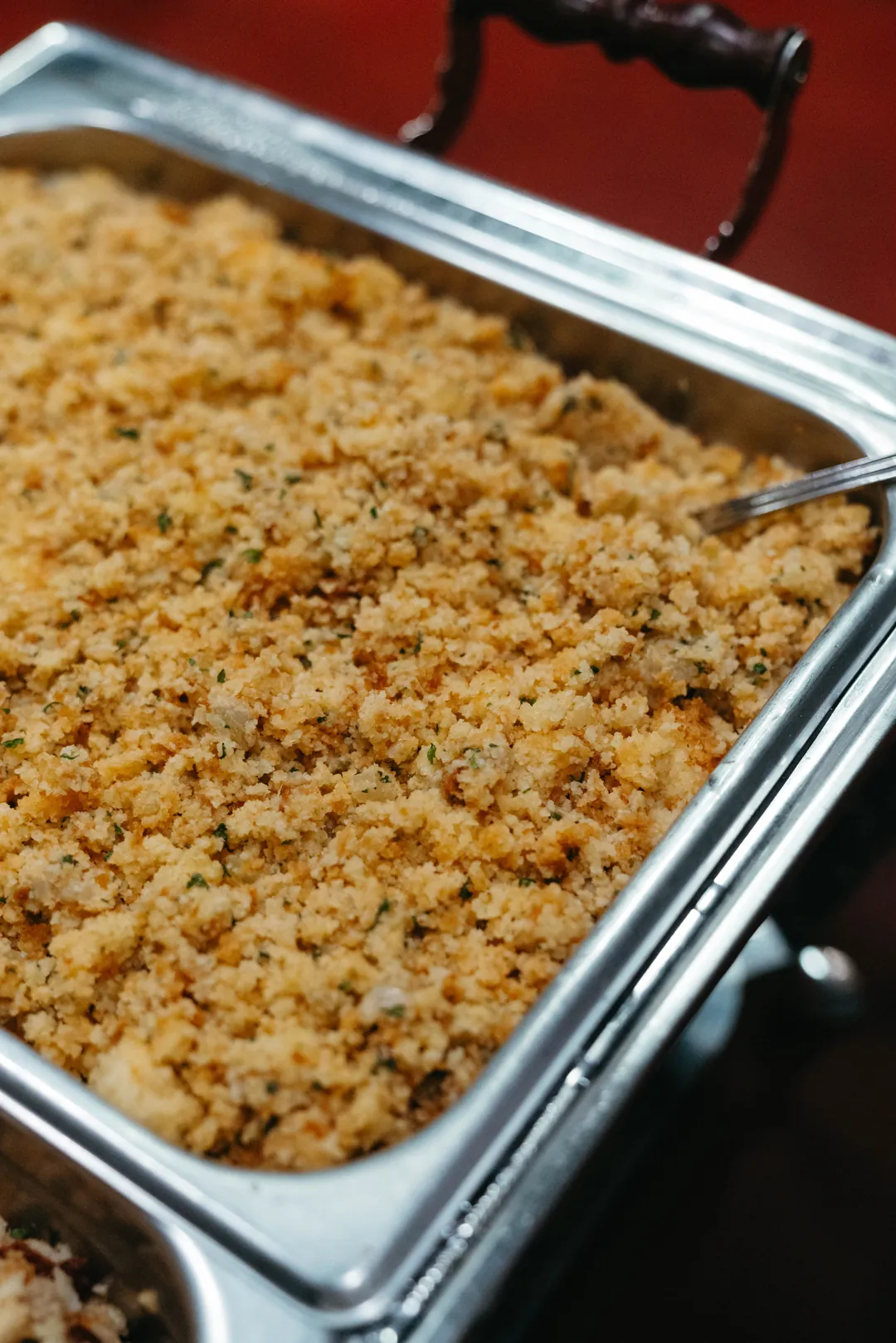Tray of prepared stuffing in a buffet pan