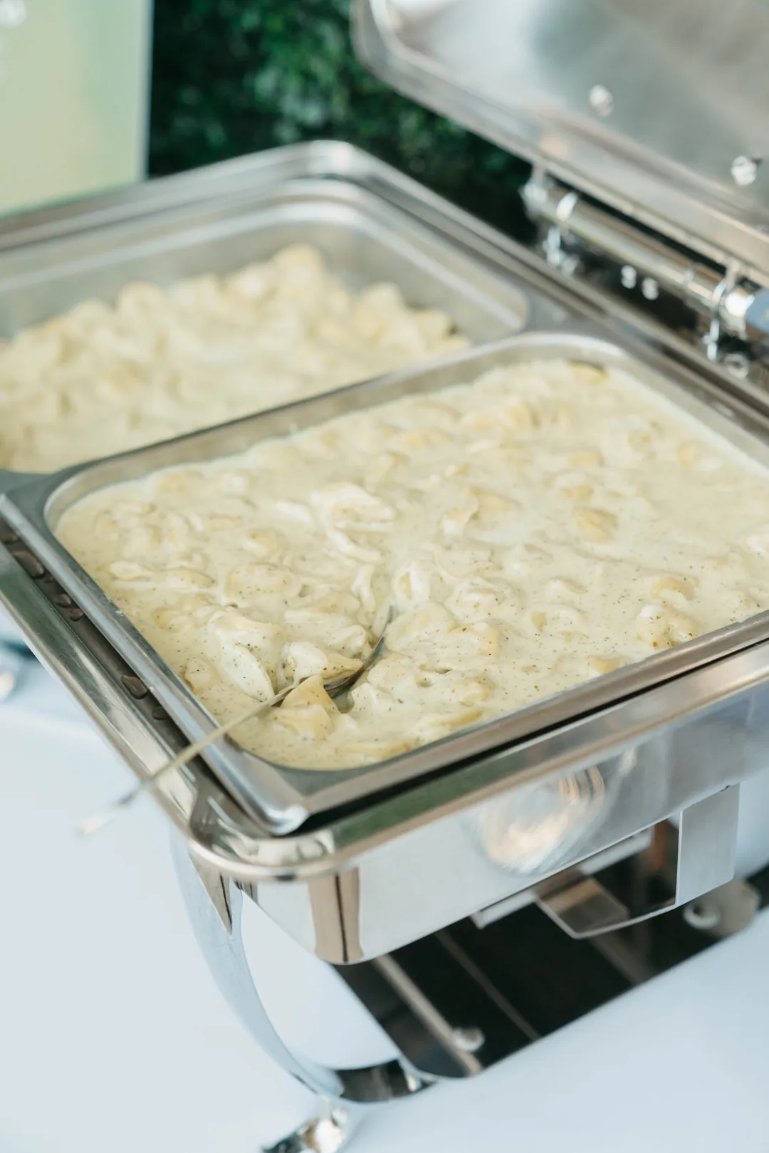 Creamy tortellini in a chafing dish