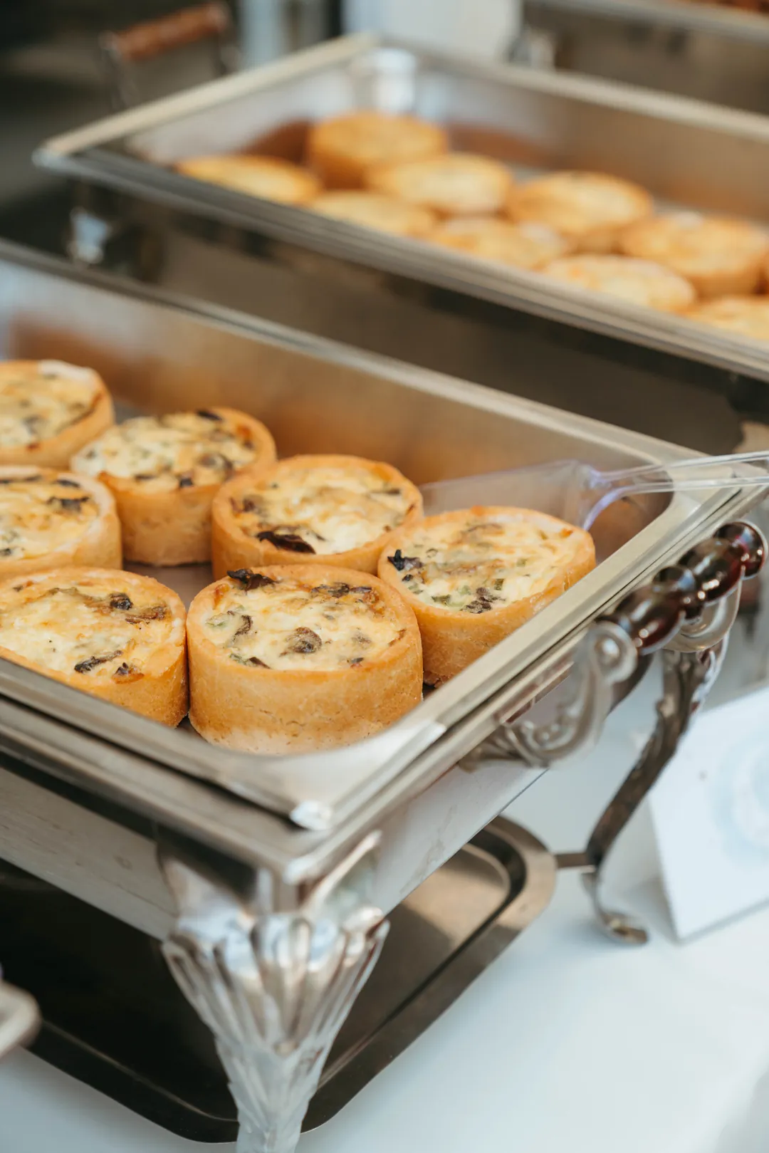 Mini mushroom quiches in a chafing dish