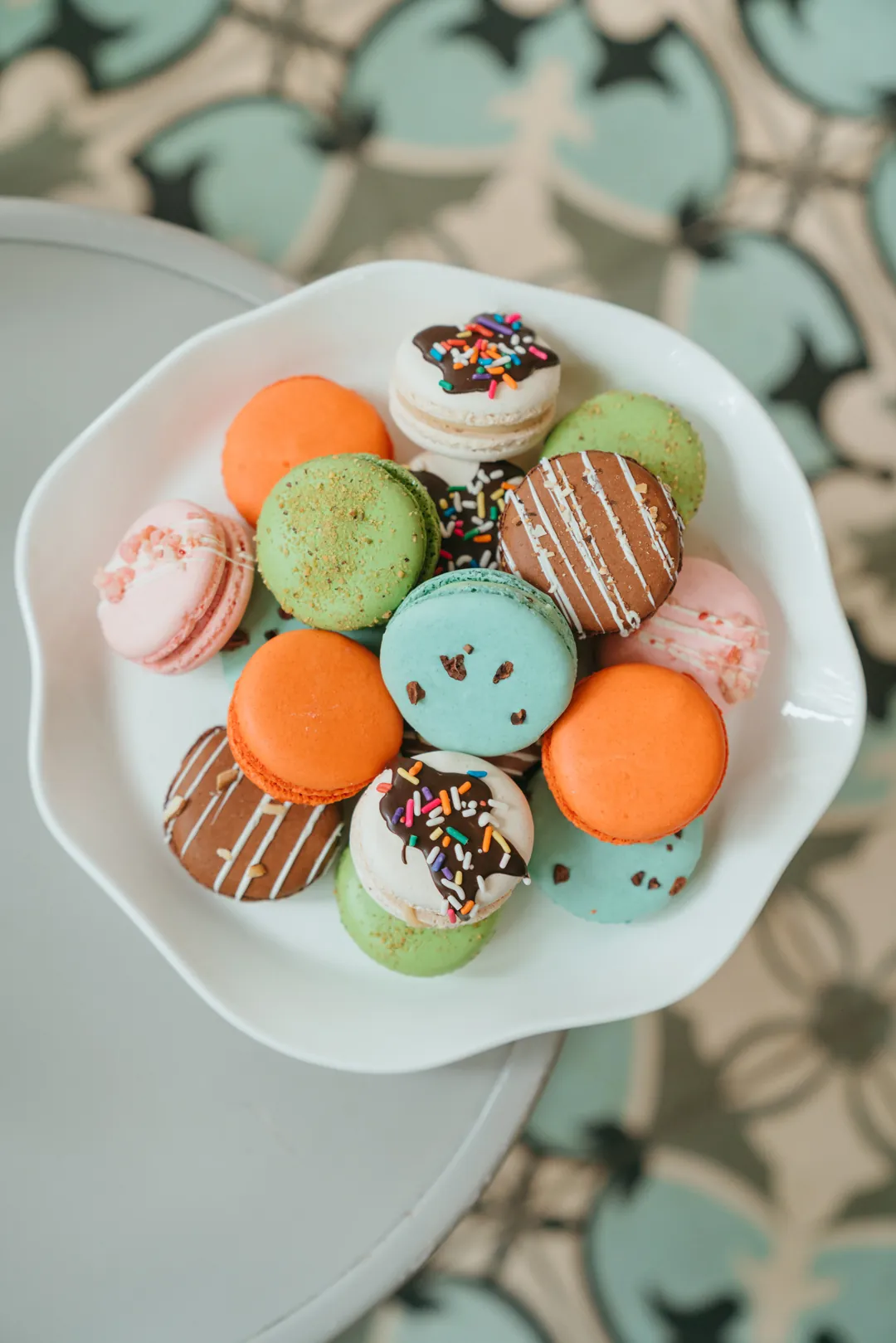 Assortment of ice cream-inspired macarons on a white plate