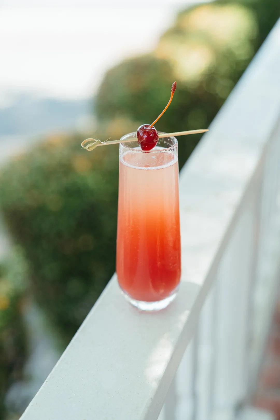Cherry Bomb mimosa garnished with a cherry