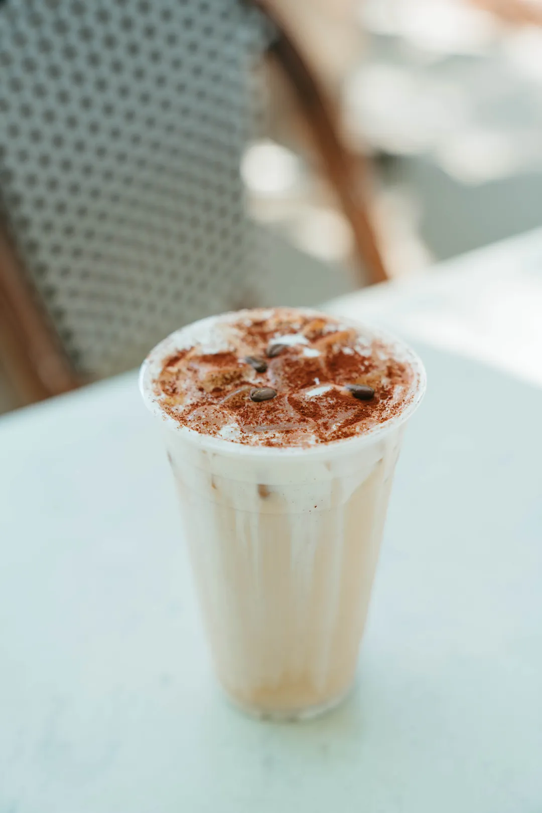 Iced tiramisu latte dusted with cocoa