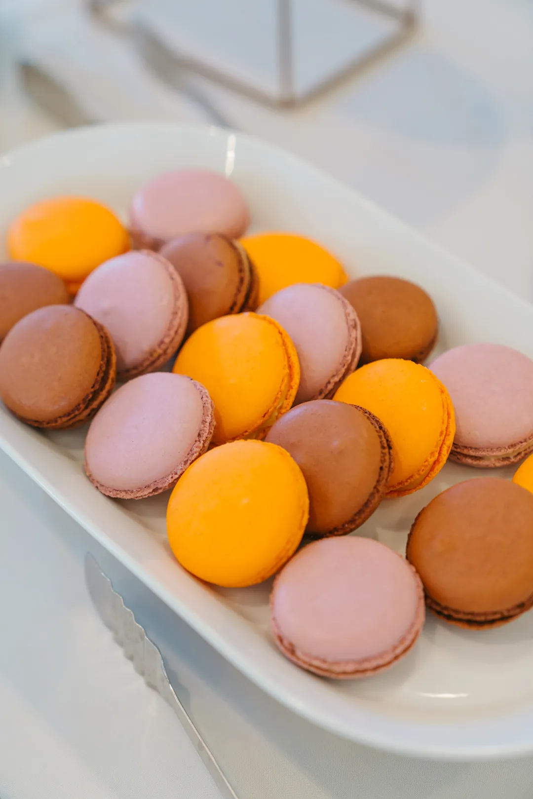 Pink, orange and chocolate French macarons