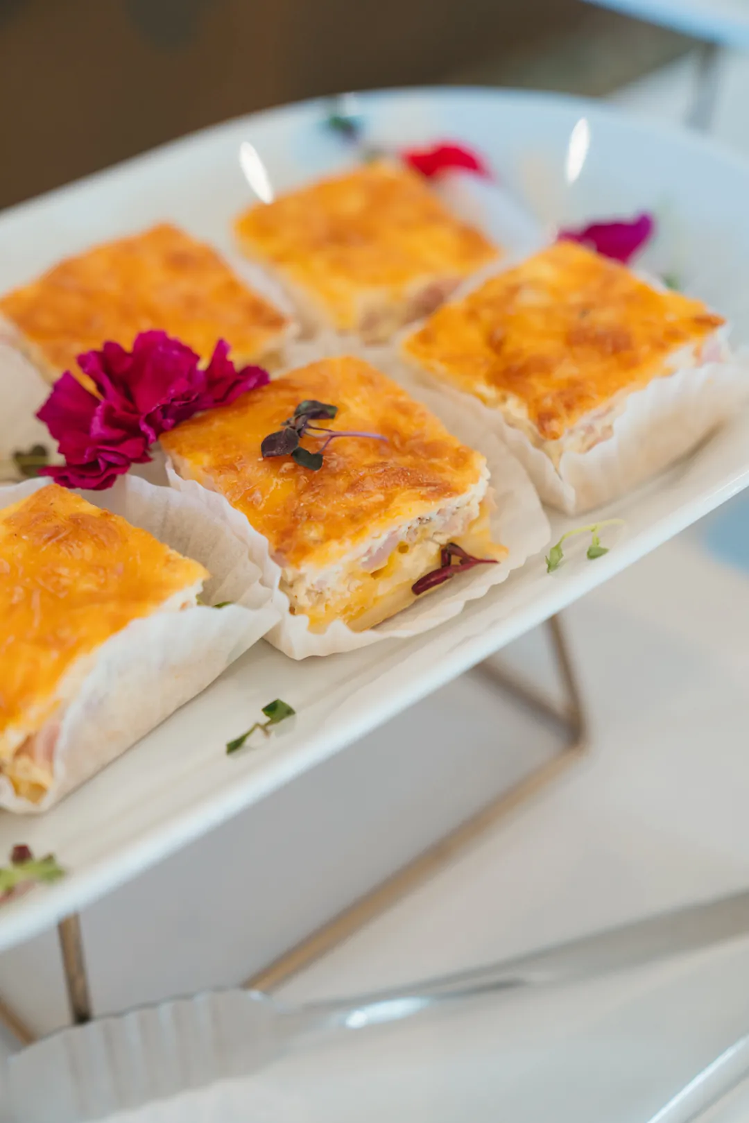 Baked quiche squares on a white plate
