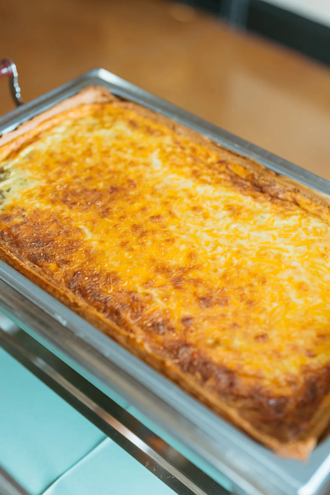 Large deep-dish quiche in an open chafing dish