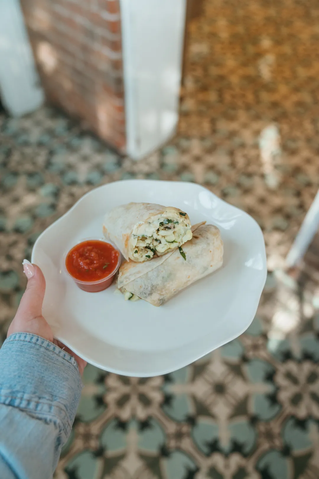 Egg white and vegetable breakfast burrito with salsa