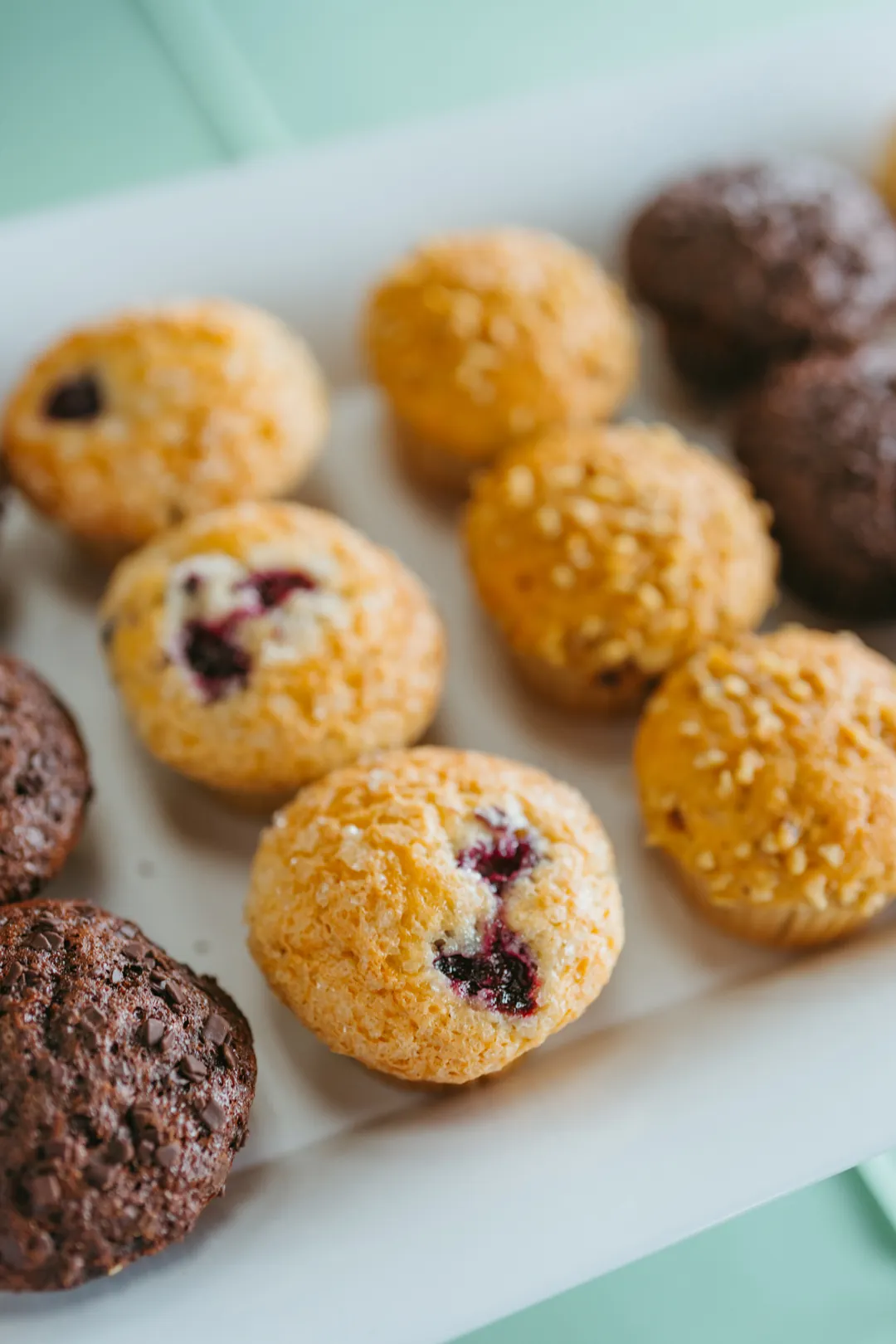 Assorted chocolate, berry and oat-topped muffins