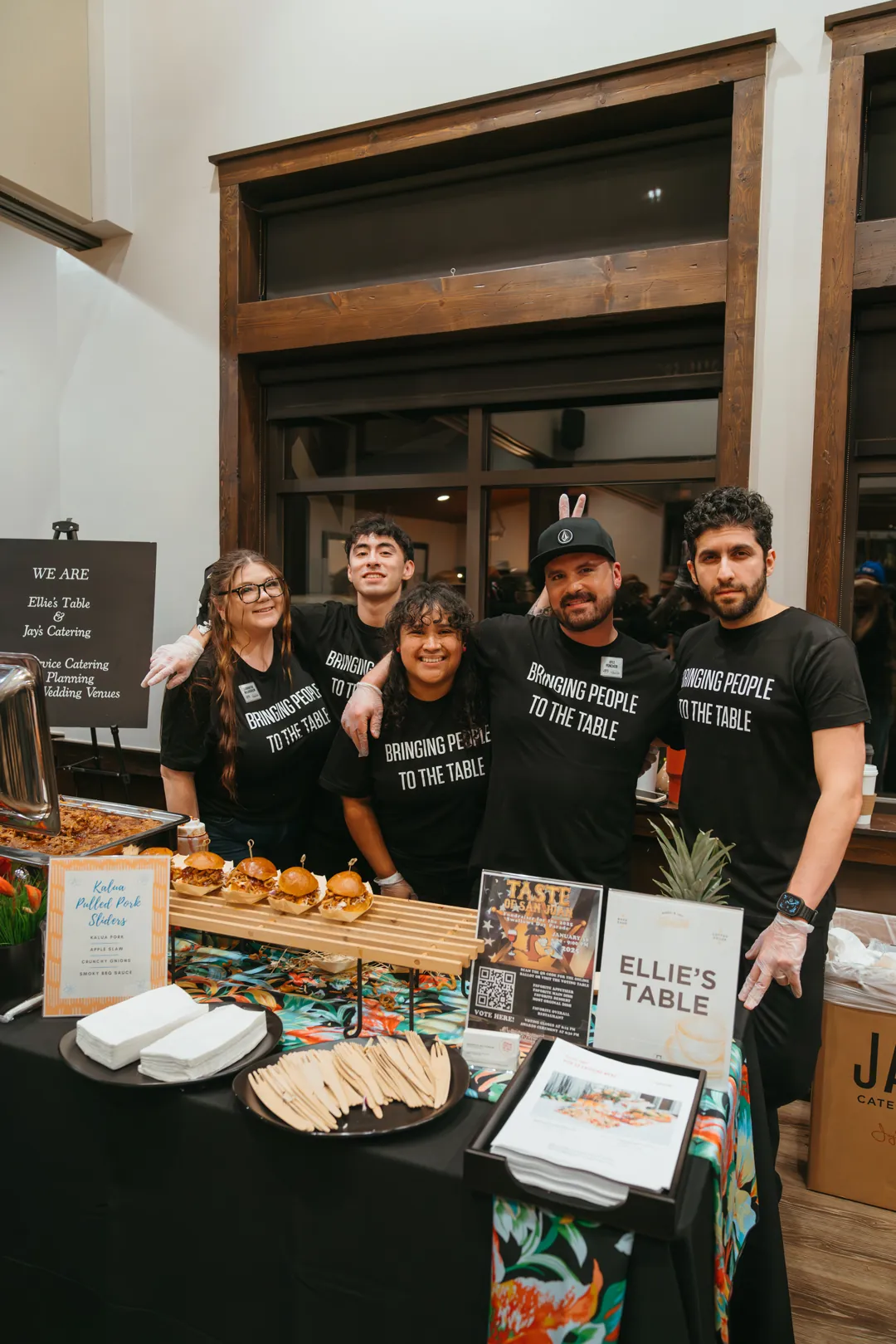 Five Ellie’s Table staff members behind the Taste of San Juan booth