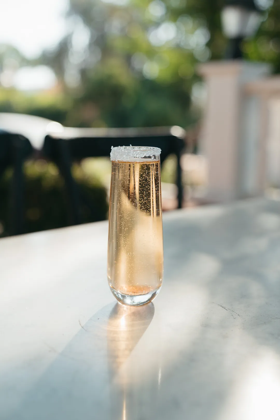 New Year mimosa with a sugar rim on the café patio