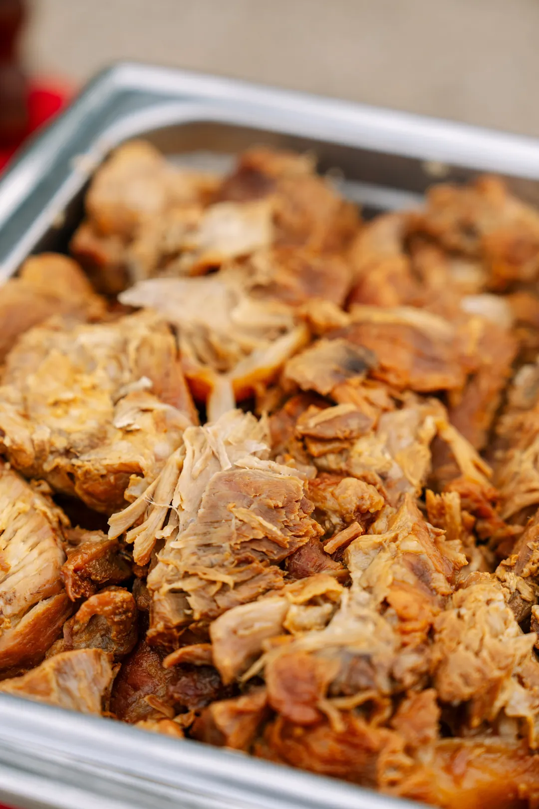 Buffet tray of carnitas for the nacho bar
