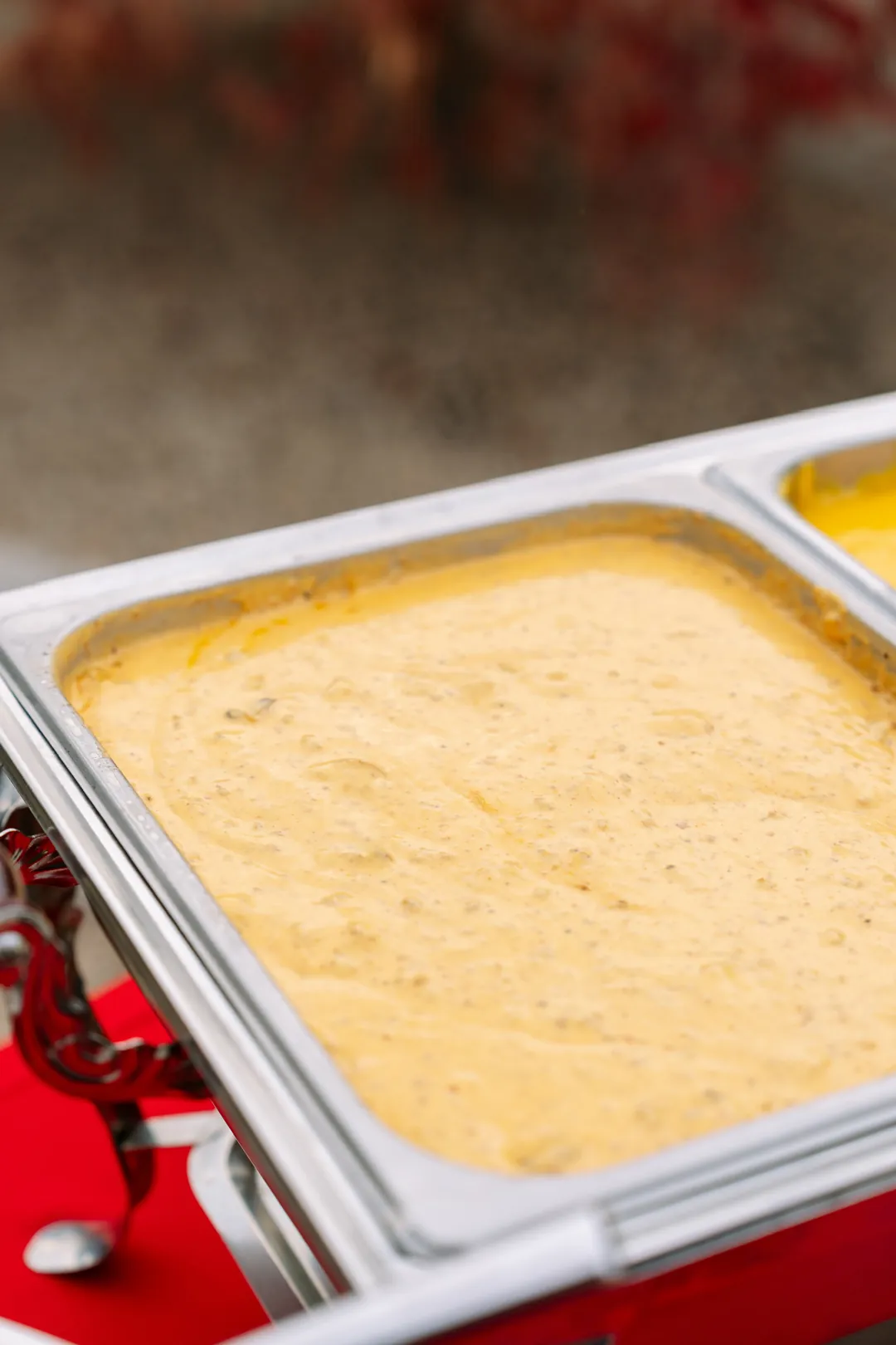 Warm queso in a buffet chafing dish