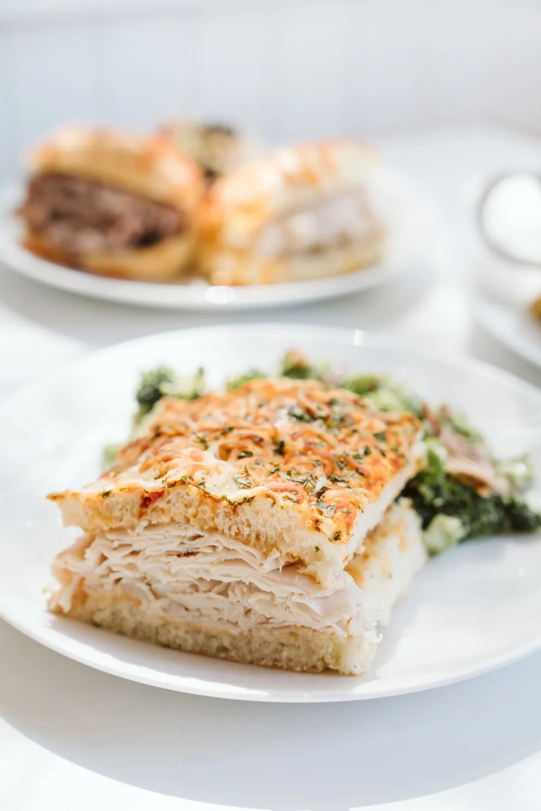 Focaccia sandwich served with a green salad