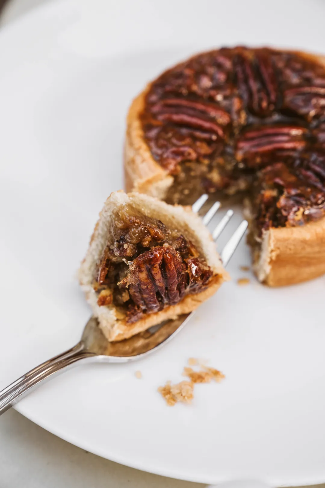 Pecan crostata with a forkful removed