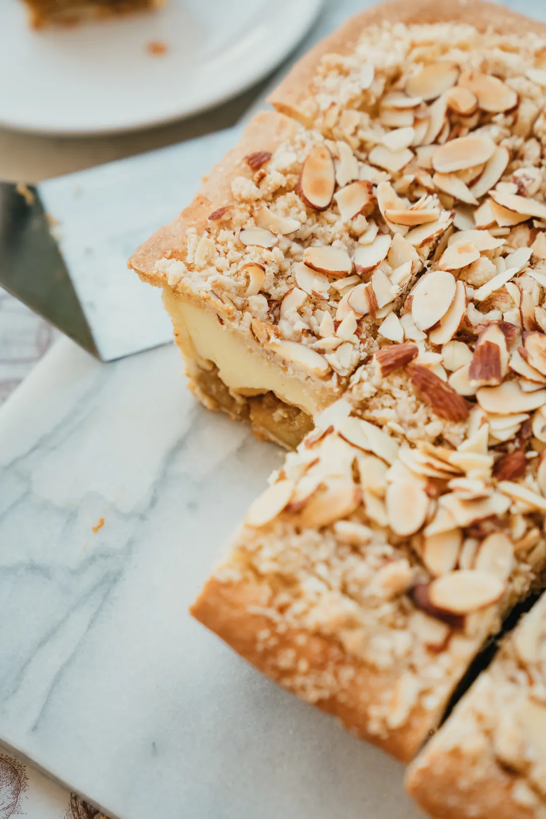 Slices of almond-topped holiday pie cake