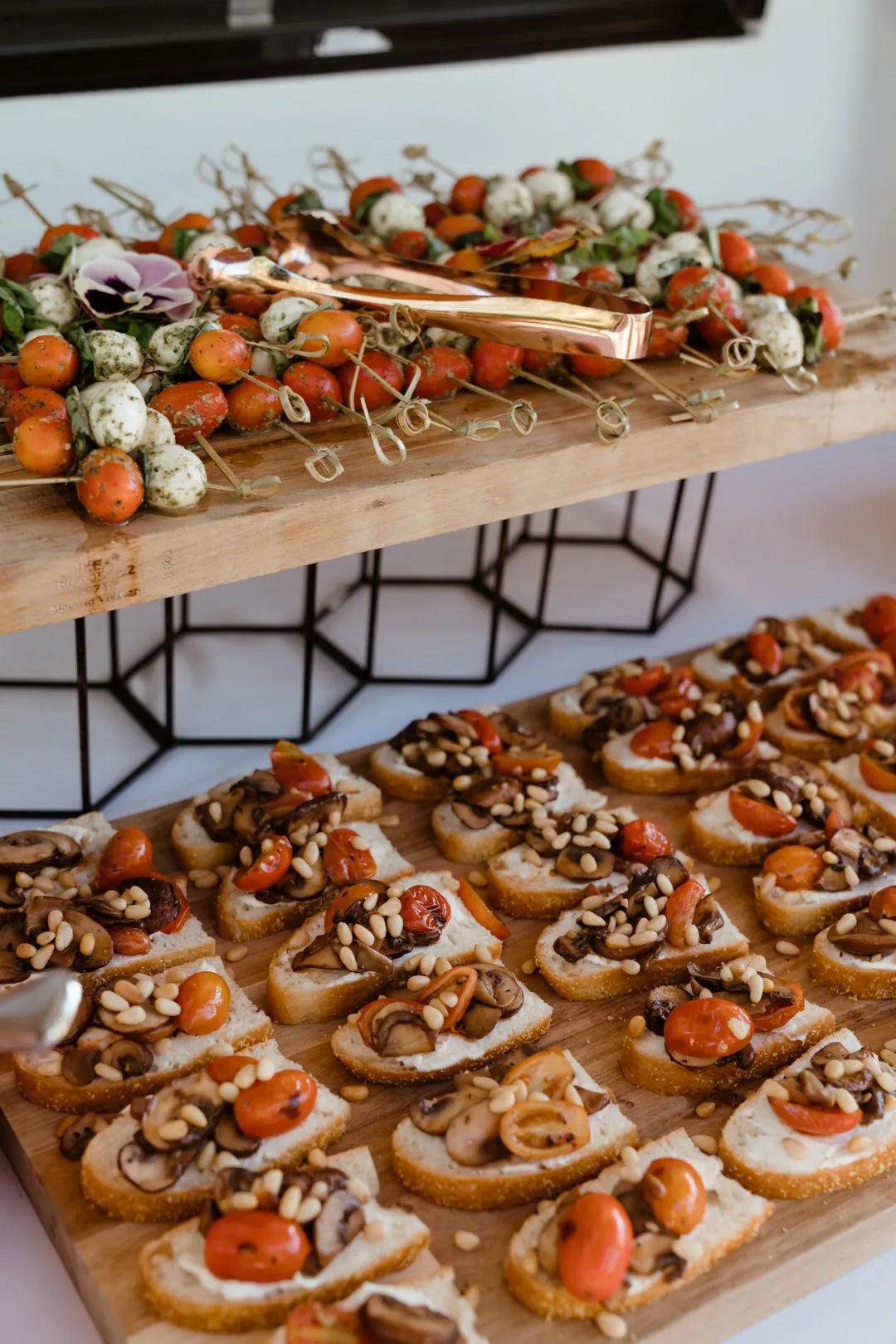 Holiday appetizer spread with rows of crostini